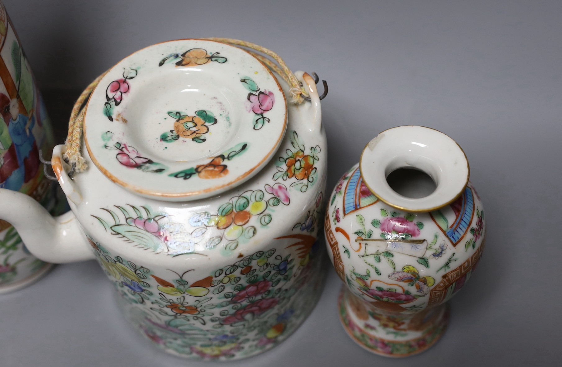 Three Chinese famille rose vases and a teapot, late 19th/early 20th century, tallest vase 29.5 cms high